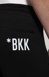 Men's sweatpants with diagonal print - BLACK | Bikkembergs